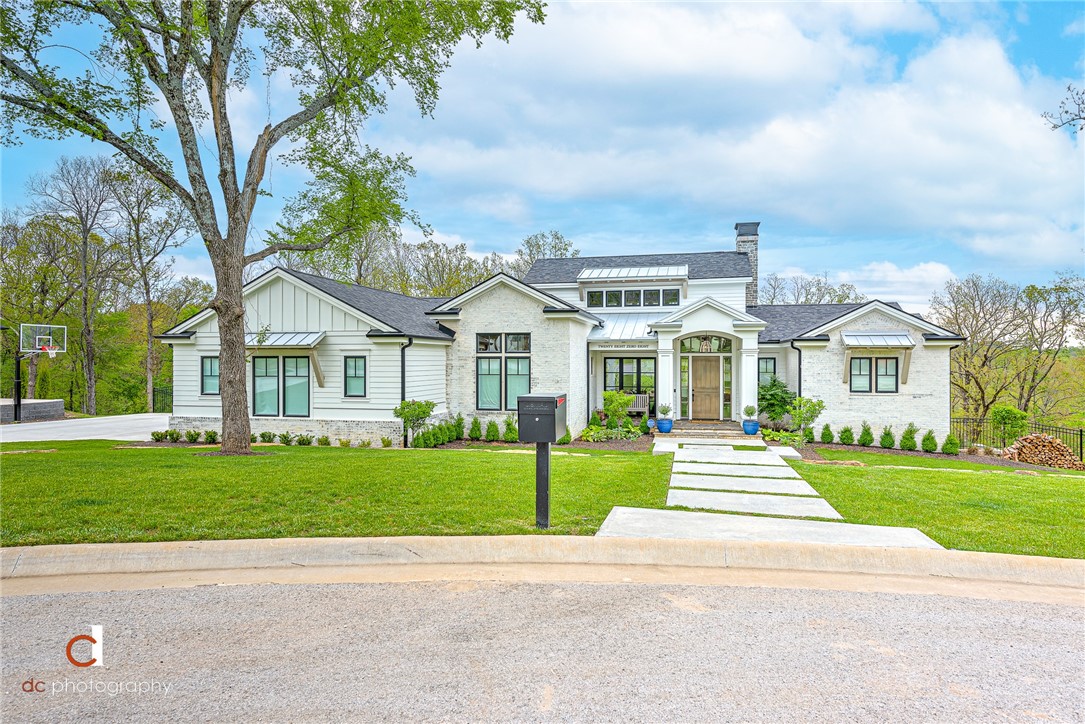 This is a one of a kind, must see parade of homes property. No detail has gone unnoticed. From the minute you enter through the split front door to the backyard patio overlooking a new Luther Stem, heated, salt water pool surrounded by AstroTurf squares. Steel fencing like on upper deck to be installed on top of retaining wall. With 5 bedrooms & 5 baths, this home is great for entertaining. Also, you will enjoy the bonus room with kitchenette, exercise room and office. Custom shades cover the casement windows, 2 full size laundry rooms, 1 car garage is heated and cooled & this property backs up to the woods. Please see attachments for an abundance of amenities.