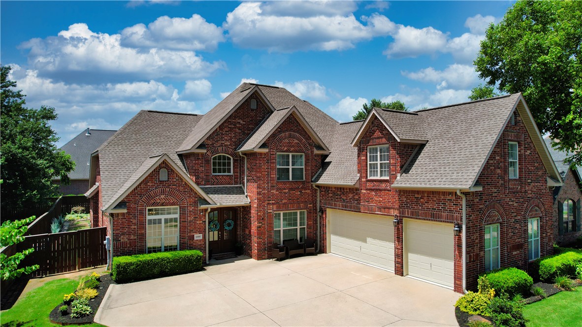 Elegant and extensively updated home in Bentonville’s sought-after Lochmoor Club. Back on market after buyer financing fell through—no fault of seller; inspections completed with no repairs requested. Features include interior paint (2022), new carpet, upgraded appliances, and designer lighting throughout. The light-filled living room boasts soaring ceilings, updated flooring, and a striking brick fireplace. Chef’s kitchen offers gas cooktop, vented stainless hood, and custom pull-out cabinetry. Smart-home lighting creates evening ambiance indoors and out. Additional upgrades: central vac, whole-home audio, intercom, and oversized garage. Bonus/media room pre-wired for projector. Private fenced yard with extended covered patio, café lighting, and room to entertain. Enjoy Lochmoor’s resort-style pool, pavilion, tennis, basketball, volleyball, and pickleball coming soon.