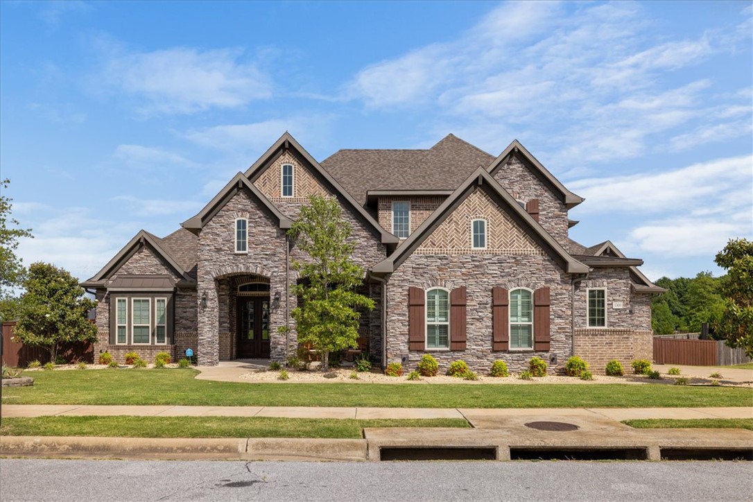 Located in the highly desirable Otter Creek subdivision, this stunning 4-bedroom, 3.5-bath home offers luxury living with exceptional indoor and outdoor spaces in the heart of Cave Springs. Positioned on a quiet cul-de-sac within the Bentonville School District, residents enjoy access to Otter Creek’s resort-style amenities including walking trails, stocked ponds, community pool, playground, pickleball and basketball courts, and scenic green spaces — all just minutes from Pinnacle Hills, top dining, shopping, and I-49. Thoughtfully upgraded landscaping enhances the home’s curb appeal with added front landscaping and soaker hoses in the flower beds for easy maintenance. The backyard was designed for entertaining and everyday enjoyment featuring a beautifully landscaped pool area, 10 added privacy panels, retaining wall, and a concrete basketball half court creating the ultimate private retreat. This home perfectly blends comfort, functionality, and upscale Northwest Arkansas living. Tornado shelter in the garage