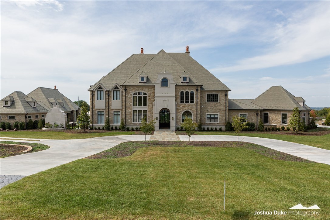 Beyond Breathtaking!! This one of a kind custom home was built to engage and entertain!  From 7 bedrooms 6 full bath & 2 half baths in the Main house to 1 bedroom 3 full baths in the Guest house. The Lovely Guest house built with the same extraordinary quality is 1975sq/ft. Total for both homes is approx 13,591 heated and cooled sq/ft. Per appraisal. You can host large dinner parties from the stunning kitchen/dining area or take in the sunset from one of the three covered patios with your family. Perfect for large inside or outside socials year round. Bluestone patios, sports pool, custom hot tub, gas fire pit, lighted sport court and infrared recessed heaters. Privacy added with new landscaping.   This is a must see Estate in one of East Fayetteville’s exclusive neighborhoods.  Call for detailed amenities list.