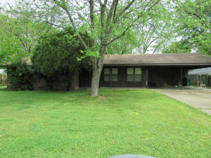 Nice area located close to Arkansas Techwith fenced backyard and outdoor storage. 2 Car carport with nice storage area, water heater and heating system have been updated in last 3 years according to Seller. Fireplace insert in the den, plus formal living area and dining.