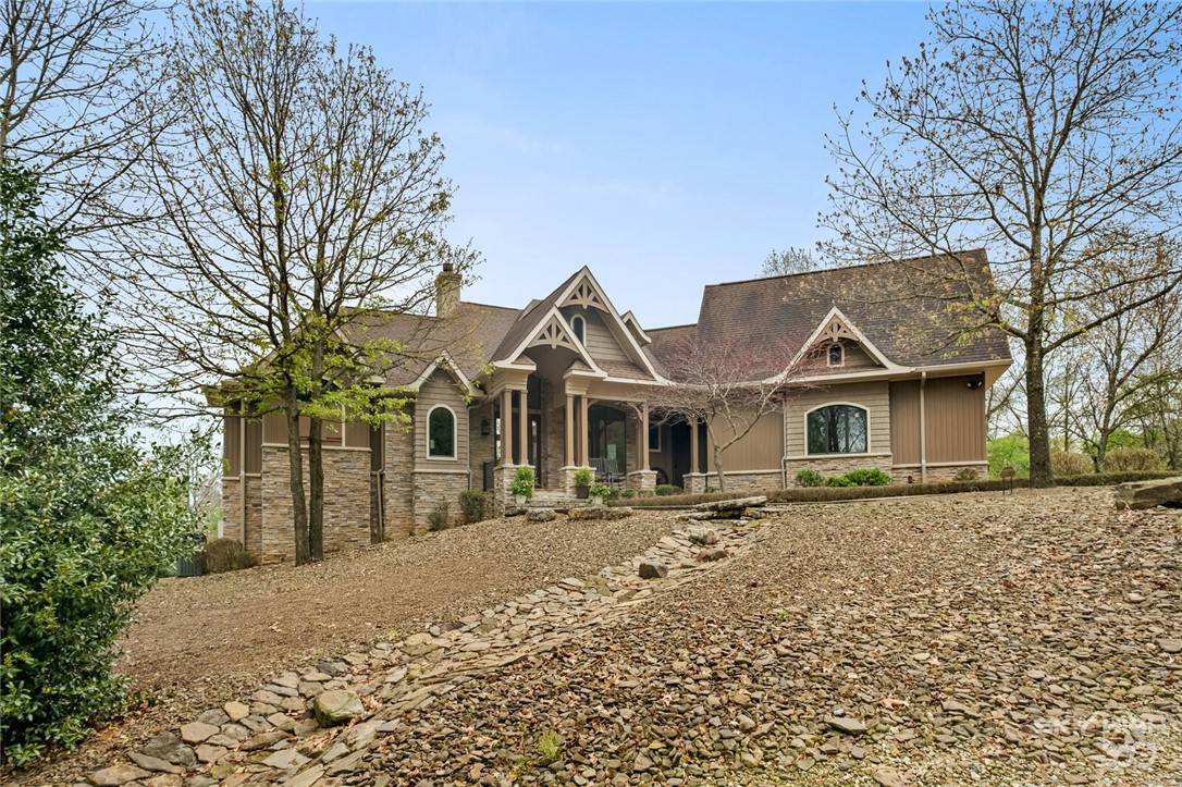 Custom built Global Luxury Home w/4Br & 3 BA nestled on 28.53 beautiful acres in gated community of Lake Shore Farms at Nelson Hollow. You are sure to love the commercial grade kitchen with a farm sink, butcher block counter, 6 burner range, double oven, coffee bar, wet bar room, plus huge walk-in pantry. The kitchen overlooks the beautiful hearth sitting area, which leads to the large, screened in porch overlooking the 28.53 acres. The formal living room boasts gorgeous wood beams, a native stone gas fireplace, w/ incredible large windows. Step into your private office w/ custom barn-doors for a zoom call. Enjoy your master suite complete w/huge master bath which includes double vanities and his and her closets and large walk-in shower.Step out to the rocking chairs on the front porch to enjoy beautiful landscaping on the north lawn area.Bring in your livestock to graze the lush 5+ acres of pasture land and make use of the 30X60 barn/shop with concrete flooring. Its all here only 8 min to boat marina!