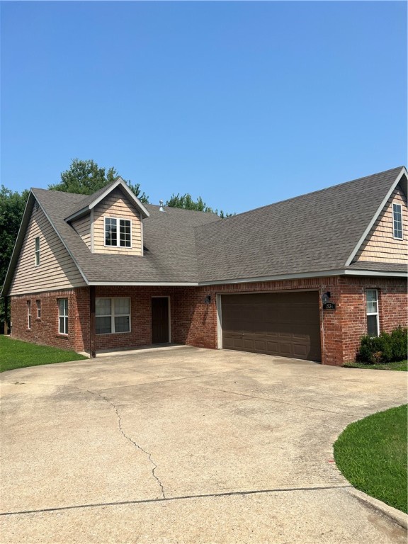Located in a prime area of Fayetteville, this property offers approximately 2,300 sqft of living space. Inside, you'll find easy-care concrete floors throughout, complemented by new carpet in the bedrooms. Upstairs, one of the bedrooms includes a bonus office space, ideal for remote work. Adjacent to the kitchen is another office space, filled with natural light from numerous windows, creating a vibrant work environment. The open layout of the kitchen and living room enhances the spacious and welcoming atmosphere. Step outside to the private backyard featuring a covered patio and mature trees providing shade and adding value to the property. Situated just 2 miles from the University of Arkansas, this location is highly convenient, with schools, shopping centers, restaurants, and bike trails nearby, offering easy access to everything this vibrant area has to offer.