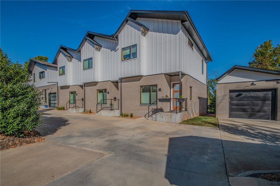 Experience the urban charm of this beautifully maintained 2-bedroom, 2.5-bathroom corner condo within walking distance to downtown Bentonville. Perfect for entertaining, the main floor offers an open concept layout with a spacious living room, half bathroom, and a gourmet eat-in kitchen featuring custom cabinetry, a Kohler farmhouse sink, quartz waterfall countertops, and wine refrigerator. Oversized picture windows fill the space with natural light and showcase beautiful views of the surrounding greenery. Upstairs, the expansive primary bedroom with large walk-in closet is highlighted by a luxurious spa-like bathroom featuring double sinks and an oversized walk-in shower. The secondary bedroom with walk-in closet and custom built-in desk provides an en-suite bathroom with glass, walk-in shower. The neighborhood amenities including a dog park, fire pit with seating, and a pavilion with grill and outdoor kitchen coupled with the proximity to trails and downtown Bentonville, make this stylish condo the perfect home.