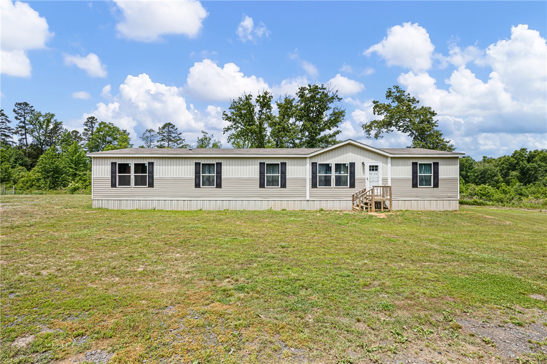 Beautiful 4-bedroom, 2-bath home offering 2,432 sq ft of living space on 10.82 peaceful acres with privacy, wildlife, and room to enjoy country living at its best. This spacious home features walk-in closets, a large dining area, split living room, extra den, very large laundry room, and handicap accessibility. The open layout is perfect for entertaining and hosting large family gatherings and holidays.
Step outside to enjoy the covered back porch where you can relax and watch the abundant wildlife, including deer that frequent the property year after year. The above-ground pool provides the perfect summer hangout, while the artesian well is an added bonus for outdoor use and the duck pond. Kids will love the wide-open space to run and play.
The property borders Rose Creek, giving you access to fishing, playing in the water, and even searching for arrowheads. Additional features include a storage building with electric and workbench, another storage shed, and beautiful natural surroundings.