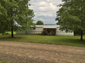 This is a great place for country living with 5.2 acres, wake up every morning and go on back deck and watch the deer feeding on your land. Nice quiet locations.*** willing to owner finance with $10,000 down ***