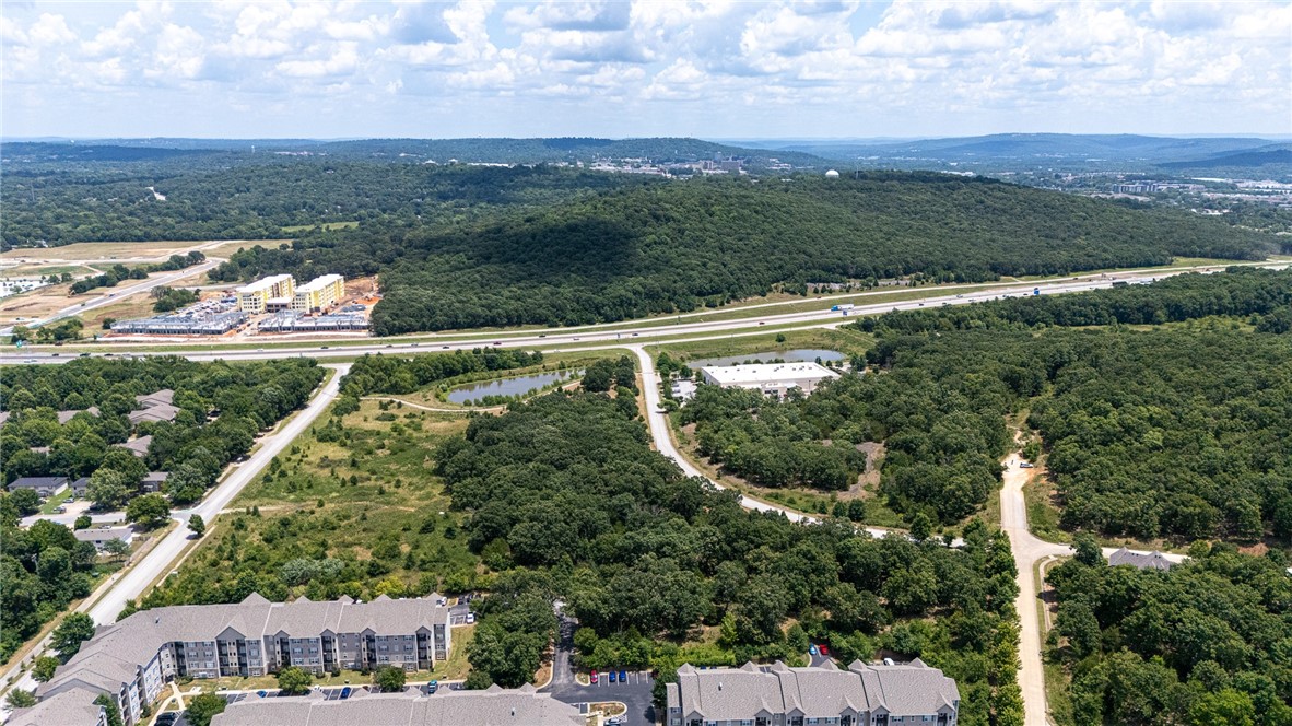 This rare four-parcel offering delivers nearly 30 acres of high-exposure, high-opportunity land in the heart of one of the fastest-growing regions in the country. Zoned C-2 and CS with City-approved High-Density City Neighborhood use, the site is ideal for multi-family, mixed-use, hospitality, retail, or office projects. Minutes from the University of Arkansas, national retailers, grocery centers, and Centennial Park’s 13+ miles of premier biking trails, the location combines regional draw with everyday convenience. A retention pond and paved access roads are already in place, simplifying future development. Strategically positioned along the I-49 corridor, Tech Way is surrounded by momentum—ongoing growth, major investments, and increasing demand. With scale, zoning, and infrastructure aligned, this is a standout opportunity for forward-looking developers ready to build big.
Parcels also available individually: MLS #1316207 (15.29 AC) and MLS #1316293 (14.28 AC).
