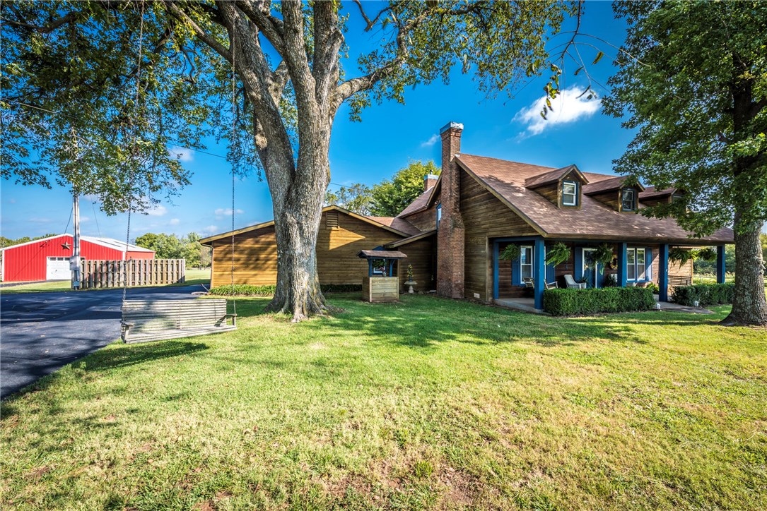 Home Sweet Home! Cedar home on 3.80 beautiful acres w/ a country feel! 4BD/3.5BA w/ 2 car garage, front & side covered porch, 3 living areas, 2 wood burning fp, bar area w/ sink, eat-in kitchen w/ lots of cabinetry, microwave, formal dining/office, crown molding in MBedroom, his&her sinks in MBath, large bed & baths, sunroom leading out to deck & in ground pool, mature trees, beautiful pond, 32x27 SQFT Shop, 12x20 Storage Building, 8x12 Outbuilding. Gorgeous views, don't miss making this home yours!