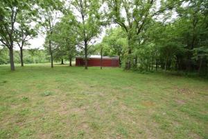 One level acre just outside of town with all utilities and a 12 x 30 storage bldg. All ready for someone to build. This beautiful acre has woods on the back side with lots of wildlife!