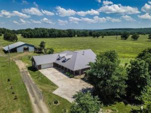 There are lovely country views from every angle of this stunning 20 acre property with a great barn!  The home is exuisite with a large open living room with bamboo floors and ajoining dining surrounded by windows to take in the lovely views.  There is an incredible kitchen with recently updated granite counters and stainless applainces, and so many cabinets you'll lose count!  The master is spacious as are the two additional bedrooms each with a cedar lined closet!  Downstairs you'll find a fully furnished suite with kitchen, full bath,  lots of space, and separate entrance.  There is so much to see here! Home can also be purchased with almost 43 acres see mls 19-656