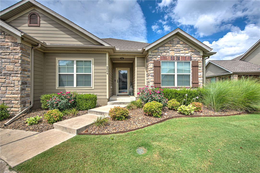 Welcome to 2504 SW Moorland in the heart of Bentonville! This beautifully maintained home offers the perfect blend of comfort, style, and convenience. Featuring an open-concept floor plan, a spacious living area, and abundant natural light, this home is ideal for both everyday living and entertaining. The well-appointed kitchen boasts modern finishes, ample cabinetry, and an island overlooking the living and dining spaces. The private primary suite offers a relaxing retreat with a spacious ensuite bath and walk-in closet. Additional bedrooms provide flexibility for family, guests, or a home office. Step outside to enjoy the covered patio with plenty of space for outdoor gatherings or quiet evenings. Conveniently located near schools, parks, shopping, dining, and just minutes from downtown Bentonville, the Walmart Home Office, and the area's world-class bike trails. Don't miss this opportunity to own a home in one of Northwest Arkansas' most sought-after locations!