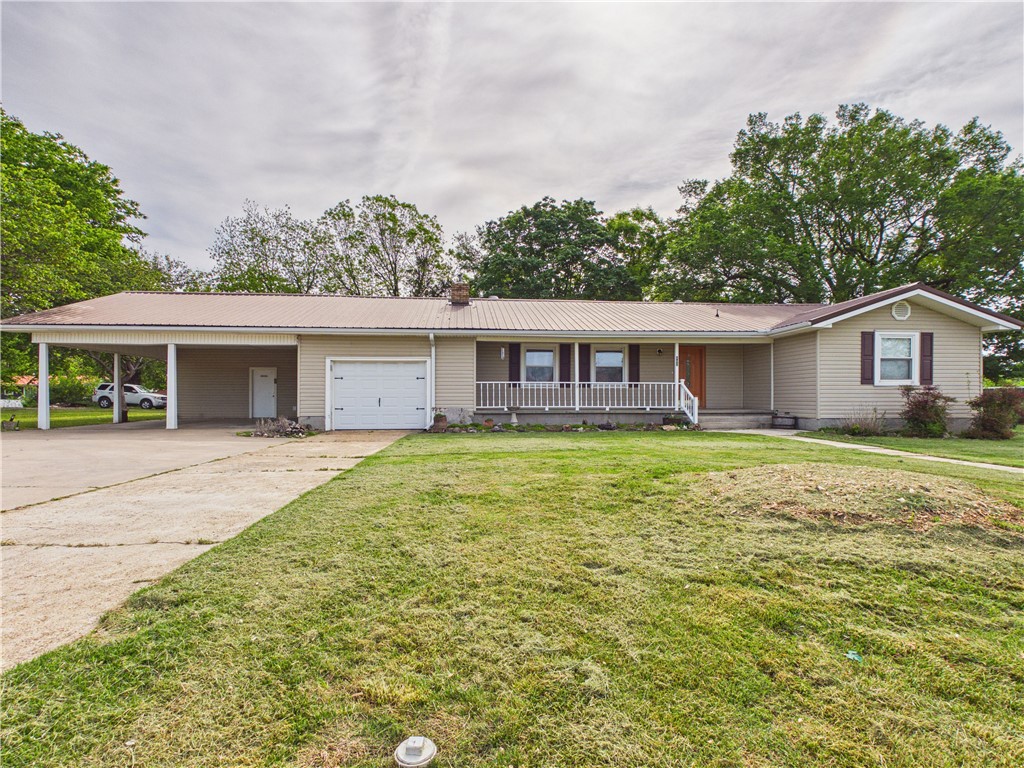 Double Lot in Berryville, AR with Remodeled Home and Shop Don’t miss this unique opportunity to own a double lot in beautiful Berryville, Arkansas. This property features a remodeled 3-bedroom, 1.5-bath home with updated finishes and a comfortable layout. Enjoy outdoor living on the covered back porch, and take advantage of multiple functional spaces including a 35x30 metal shop, garage, and carport—offering plenty of room for storage, projects, or hobbies. The additional lot provides extra space and flexibility, making this property a standout in the area. If you’re looking for a well-rounded property with updates, workspace, and room to grow, this one is worth a look.