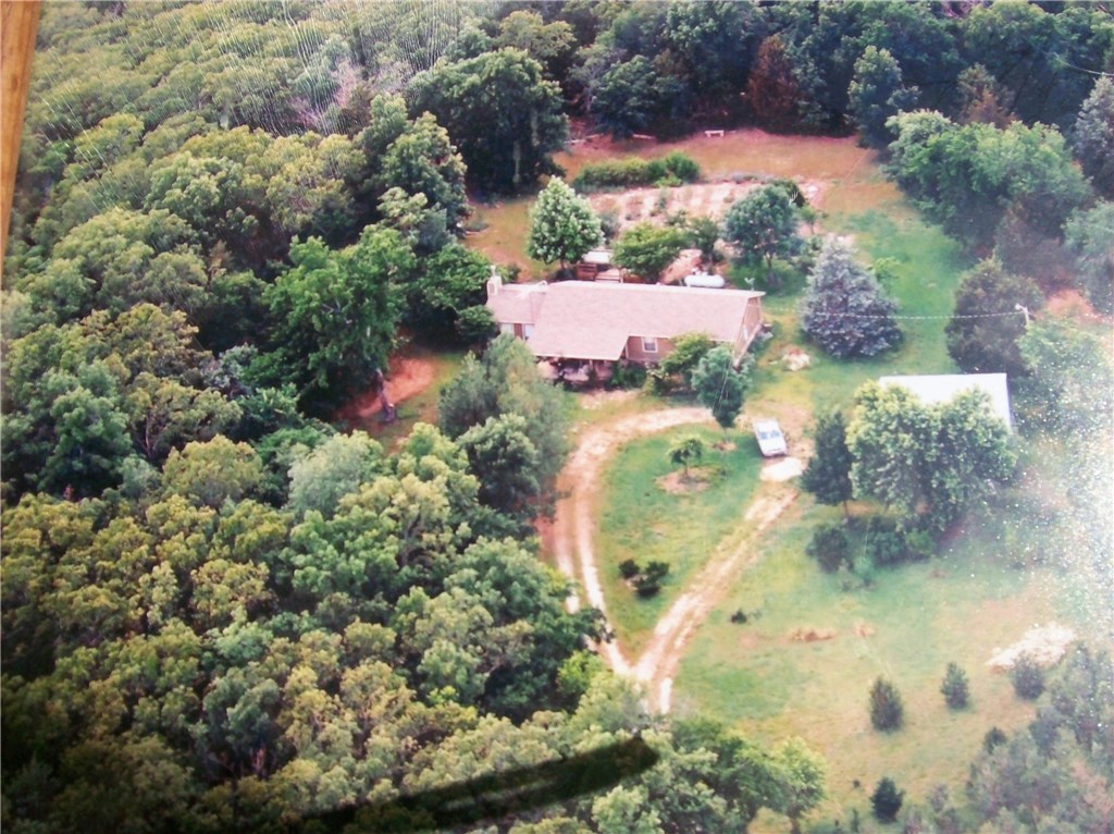 3 BD 2BA on 11.97 acres:  5 acres silt loam pasture, 5 acres wooded hillside and rest around house with good garden area and lots of perennials. 30 x 30 metal shop with electric and large door (could be garage).  House has ceramic tile throughout,  quartz countertops ,2 living areas, Lopi  woodstove (chimney cleaned this year), new roof in 2011.  No showings on Monday or Thursdays.
