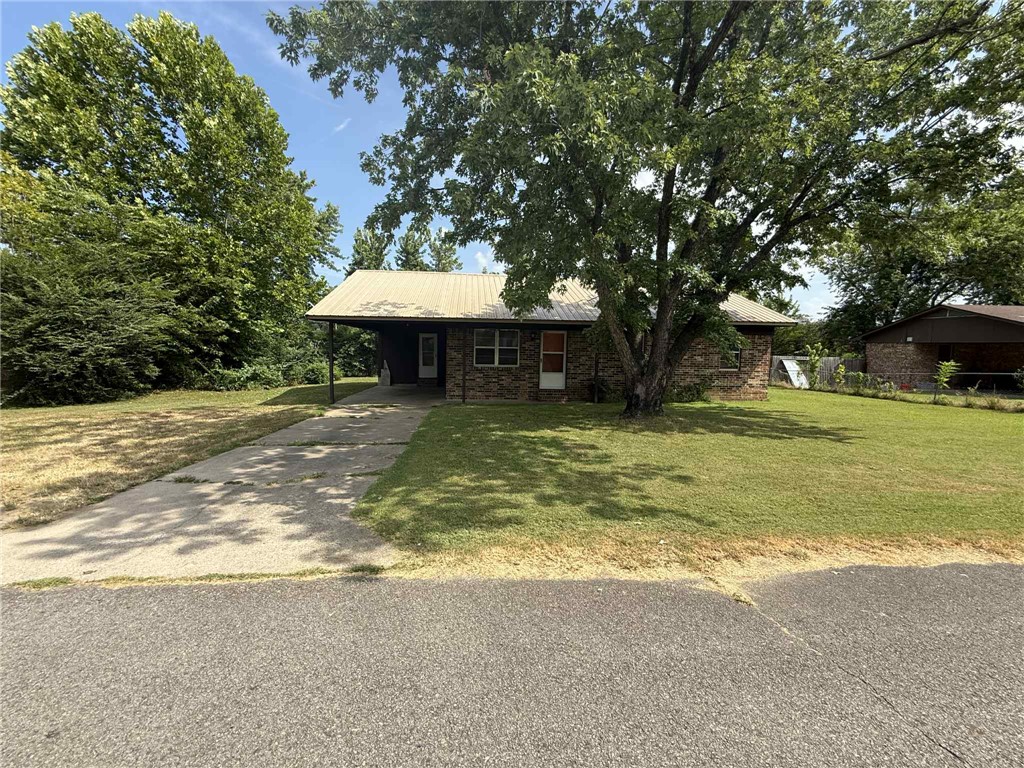 Welcome to 1803 E Harkey ST, a single-family residence in Paris, Arkansas, built in 1980. The metal roof provides  years of service. This property offers a unique opportunity to create your ideal living space on a manageable .27 acre lot. With three well-proportioned bedrooms and a large bathroom with tiled step in shower. This home has an open kitchen, dining, and living area. It presents a canvas for personalized living.