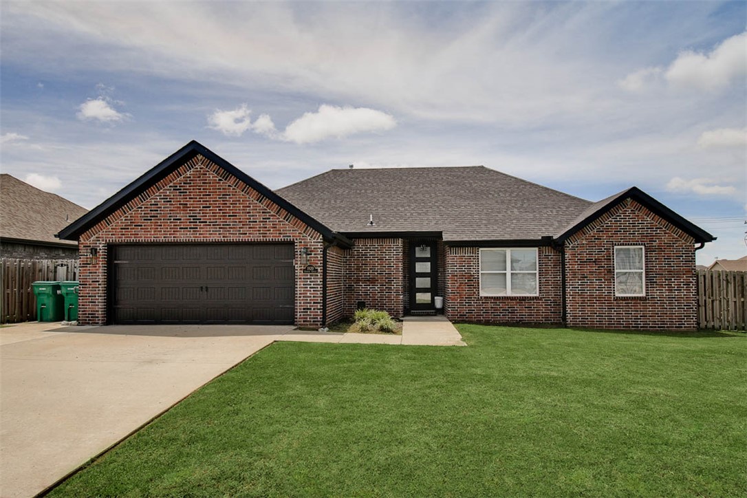 4 bedroom, 2 bath well-maintained all brick home in a desirable Centerton location in Sunrise Ridge Neighborhood! This home offers a nice open concept layout with a split floor plan for added privacy and modern finishes throughout. Beautiful tile wood flooring runs through the main living areas, with bedrooms thoughtfully separated. The kitchen and living space flow seamlessly, creating an easy, functional layout for everyday living with great natural light. The garage features an epoxy-coated floor for a clean, finished look. Located near Bentonville West High School and Gamble Elementary, with easy access to I-49 and just a short drive to Coler Mountain Bike Preserve, Walmart HQ, Downtown Bentonville, and XNA airport!