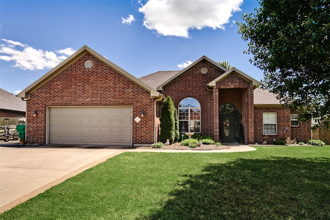 Escape to your own private retreat in this beautifully landscaped backyard featuring  a flagstone patio and pergola — an ideal setting for relaxing evenings with family and friends. This immaculate 3-bedroom home offers an open-concept floor plan designed for comfortable living and effortless entertaining. The split-bedroom layout provides added privacy for the primary suite. Enjoy walking-distance access to Bentonville West High School and a quick commute to the new Walmart campus.