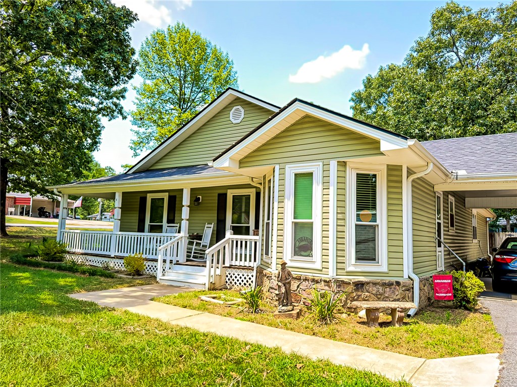 Welcome Home to 4 Porcupine Trail

Set on a quiet corner lot in Conway, this 2,316 sqft home welcomes you with a wraparound front porch, mature shade trees, and lovely landscaping that make every arrival feel like coming home. Inside, 3 bedrooms and 2 baths offer easy, comfortable living, with a cozy gas fireplace ready for cool, quiet evenings at home.

Set on two lots, the huge backyard is a blank canvas for gardens, play, or weekend gatherings, while the brand-new workshop gives hobbies and projects a home of their own. Two carports add everyday convenience and plenty of space for vehicles, yard equipment and recreational equipment.

Peaceful, established, and full of charm, this is a place to put down roots and breathe a little easier. Come see 4 Porcupine Trail for yourself.