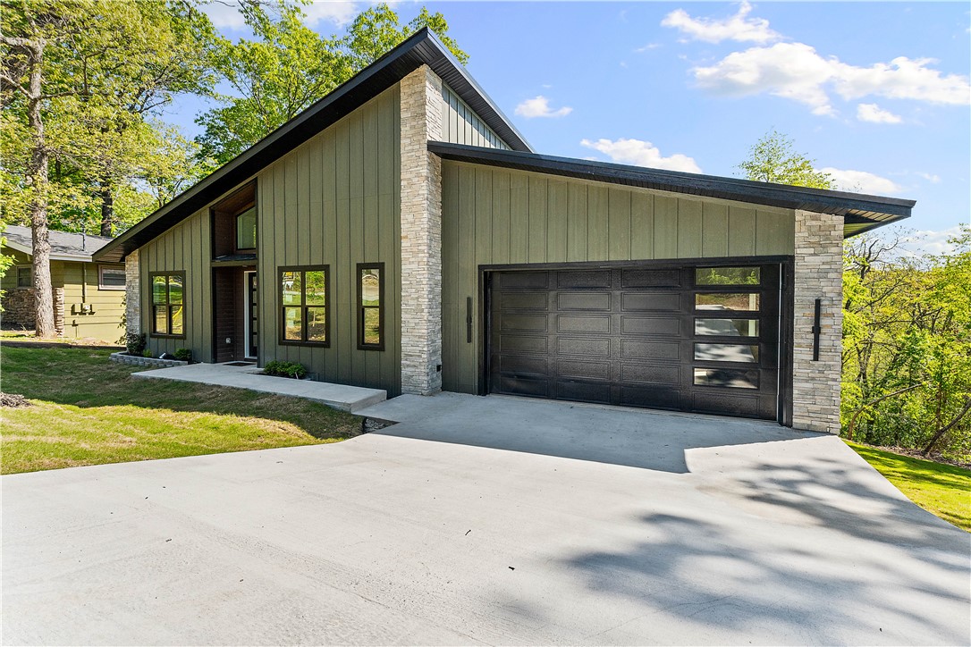 Perfectly situated on the Flow ride section of the Back 40 and minutes from Lake Ann, this high-quality build prioritizes both design and function.

A bold, moody exterior opens to 24-foot ceilings and massive windows that flood the engineered hardwoods with light. The main level features a chef’s kitchen with GE Cafe appliances and a primary suite with a full-tile spa wet room and soaking tub.  The oversized garage is wired for a 220v EV and features a clever grocery pass-through door that slides your haul straight into a pantry hidden behind a custom Murphy door. Two additional bedrooms and a second bath round out the main floor.

The walk-out lower level adds a second living area, a third full bath, and a heated/cooled shop with a hidden storage room tucked behind another Murphy door. From the quality craftsmanship to the clever secret spaces, this home offers a sophisticated, functional lifestyle you have to see in person.

Agent Owned. Builder offering up to $10,000 in buyer concessions.
