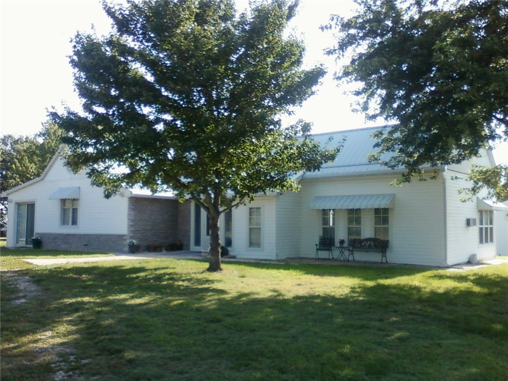 Great location on blacktop county road between Berryville and Eureka Springs. 2,7 acres with nice view, home has many rooms for a large family.  30 X 40 garage/shop.  2 more buildings
