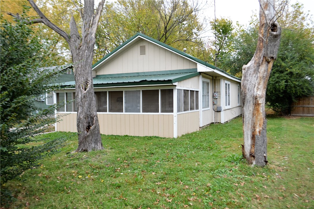 A beautiful screened-in porch welcomes you into this cozy two bedroom one bathroom home. Perfect for a rental, or starter home, a spacious fenced back yard provides a place to relax after a hard days work. Large detached workshop has room for all those DIY projects or a place just to store stuff. Close to The Jones Center and downtown Springdale.