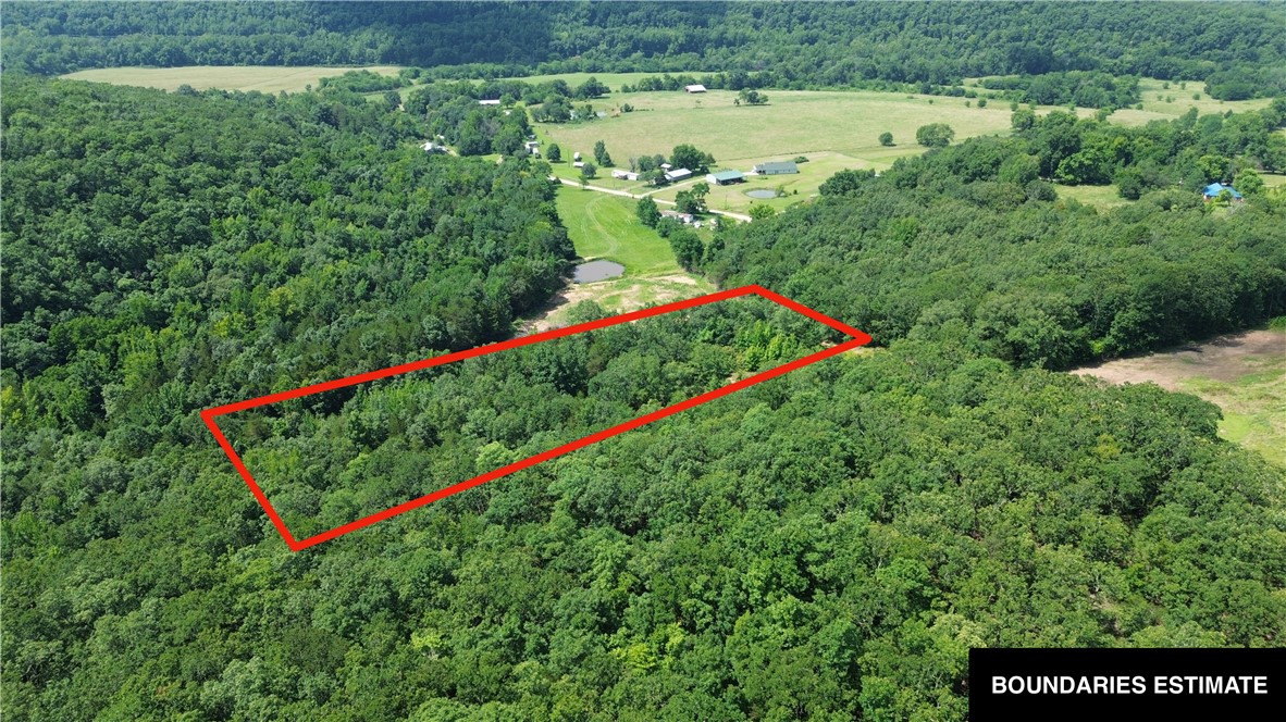 5 wooded acres offering privacy and seclusion, close to the White River. A small clearing marks the spot where a mobile home once stood — ready-made for your new setup. Electric and public water are available to the property; septic system will be needed. A peaceful, nature-filled setting off Madison 5550, minutes from Elkins.