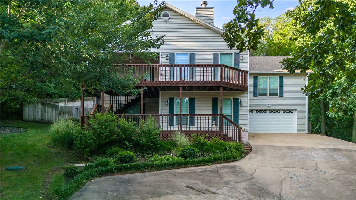 Live near the water in this spacious Bella Vista beauty! Welcome to 21 Castleford Dr, a well-maintained 3,920 sq ft ranch-style home located just minutes from Lake Ann. Nestled on a quiet 0.42-acre lot, this 3-bedroom, 3-bath home offers an open-concept layout perfect for both everyday living and entertaining. Enjoy features like a cozy fireplace, central A/C, an attached garage, and plenty of natural light throughout. The expansive floor plan includes large living spaces, comfortable bedrooms, and flexible bonus areas to suit your lifestyle. Step outside to a peaceful backyard retreat or head down the road to enjoy fishing, kayaking, or hiking around scenic Lake Ann, one of Bella Vista's most loved recreational spots.