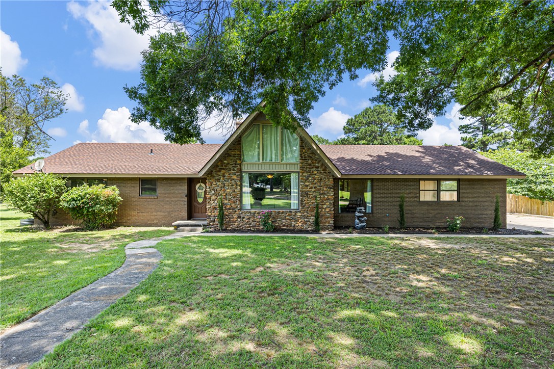 7 acres, a pond, a detached guest house, and an in-ground pool! Trade the noise for seven acres of Arkansas quiet, where the Ozarks are your alarm clock, the pasture is ready, and the pond's already stocked. Step outside first, because that's where this place wins you over. The land is cross-fenced and ready for livestock the day you move in. That stocked pond is waiting for your first cast, and just off the back porch, an in-ground pool turns every summer afternoon into a staycation. There's room to garden, raise a few animals, and let the kids and dogs run. Inside, the 2,100 sq ft main home holds its own, remodeled with genuine character: exposed wood beams, custom cabinetry, and natural light in every room. Three bedrooms and a versatile loft give everyone space, with two full baths. The detached ADU, with its own full bath, works as guest quarters, a studio, an office, or rental income. Ozark views, minutes from downtown Clarksville. Homestead-ready and genuinely rare. Come see it before it's gone.