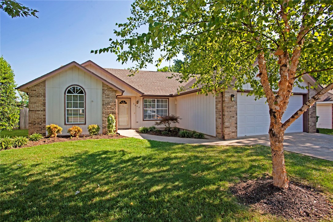 Great Location in Rogers, close to shopping, walking trails and interstate I-49,  this 3 bedroom 2 bath home has all new paint and carpet.  Home has split floor plan, large open living room kitchen area with vaulted ceiling and fireplace.  Additional sunroom.  Great landscaping, fenced yard with a great storage/workshop.  Buyer Bonus refrigerator, washer and dryer will stay. Won't last long.