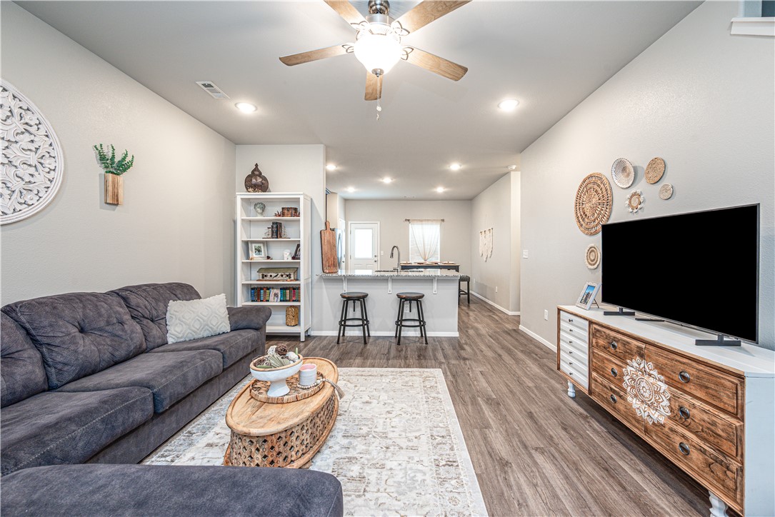 Great home in a sought-after area with fantastic community amenities! Enjoy paved walking trails throughout the subdivision that connect directly to Janie Darr Elementary, allowing kids to walk or bike to school via sidewalk trails. The community also offers a shared green space and playground, perfect for gathering with neighbors and enjoying the outdoors. Conveniently located near top schools, shopping, dining, and entertainment, with the Pinnacle Hills Promenade area just minutes away. This two-story home features 4 spacious bedrooms with large walk-in closets, 2.5 baths, and an oversized bonus room that could serve as a 5th bedroom, game room, or media room. The fenced backyard includes a unique rock retaining wall with a charming courtyard-style outdoor living space. Easy commute to major employers, including Walmart Home Office and J.B. Hunt.