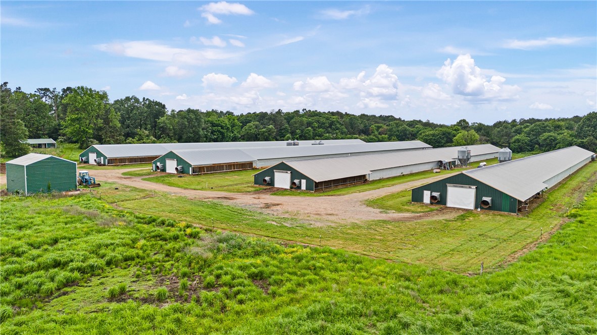 Turn-Key 4-House Wayne Broiler Farm on 70± Acres

This fully operational poultry farm offers exceptional income potential and scenic beauty. Featuring (4) 43’x500’ broiler houses with Choretime controls, waterers, and feed lines, this farm is designed for efficiency and ease of operation. Additional improvements include a 40’x105’ litter shed, 30’x20’ water room with (4) 5,100-gallon water tanks, two Deutz generators, and (4) 1,000-gallon propane tanks ensuring seamless production. Stocked pond for fishing. The surrounding lush hay meadows planted in rye and mixed grasses add value and versatility to the property. Enjoy breathtaking views of Mt. Magazine while benefiting from an average annual income of approximately $250,000.

An outstanding opportunity to own a proven and profitable farm.