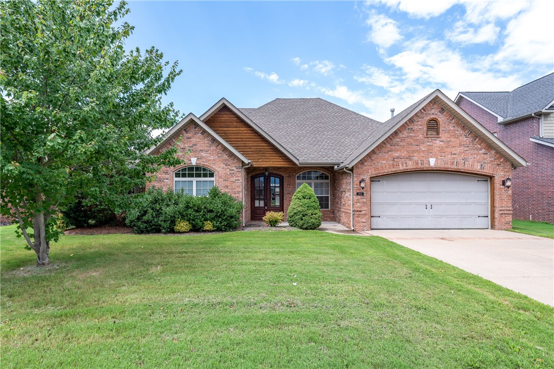 Elegant Bentonville home located in the Oxford subdivision with access to the community pool! Throughout the home you will find rich woodwork, custom cabinetry, and tile flooring - no carpet! Fenced, level lawn and covered patio for outdoor entertaining. All appliances included. Make this immaculate home yours today!