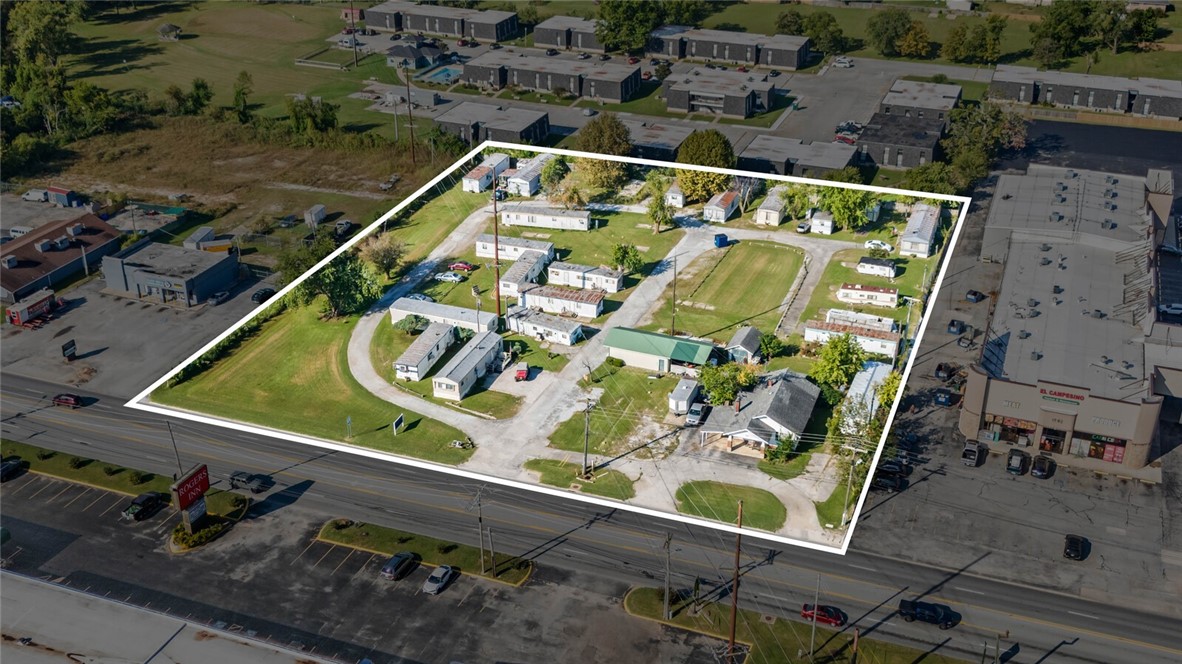 Active Income-Producing Mobile Home Park on 2.7 Prime Acres! Seize this incredible investment opportunity-an established mobile home park situated on 2.7 flat, high-visibility acres right along Highway 71B, one of the busiest corridors in Northwest Arkansas! This income-generating property includes 30 total slips with full city utilities, plus the original 1,245 SF homestead home-use it as an onsite management space or rent it out, and a 40x50 workshop-perfect for storage, maintenance, or additional income potential. Currently, only 10 slips are rented, leaving plenty of room to increase cash flow and maximize returns. With its prime location near downtown Rogers, I-49, and Beaver Lake, the possibilities for future development or increased rental income are virtually endless. Don’t miss out on this rare opportunity in one of the fastest-growing areas of Northwest Arkansas. Call today for details-motivated sellers are open to owner financing!