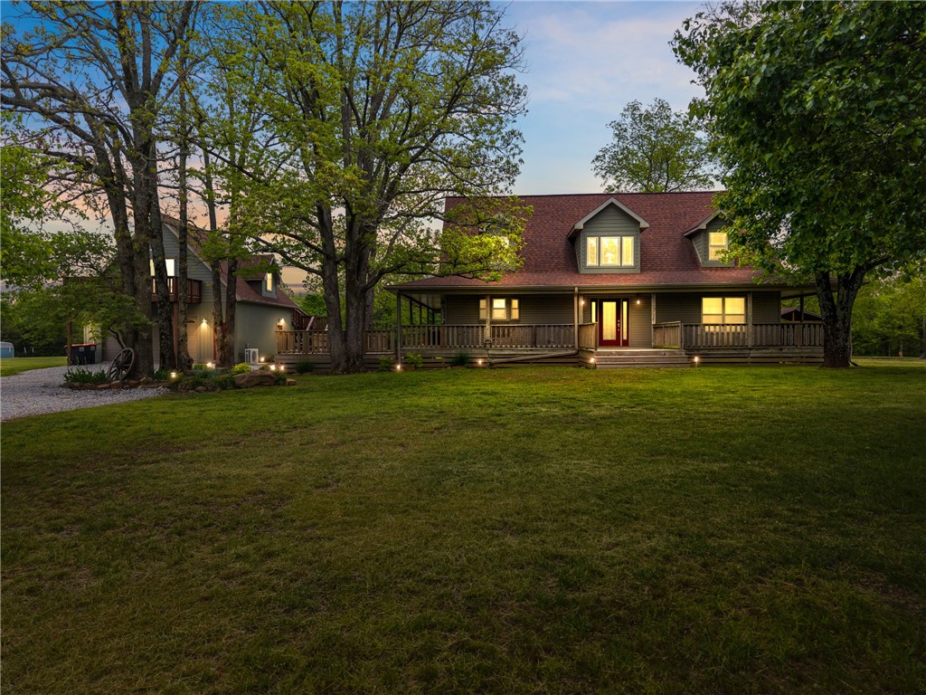 Experience country living in this exceptional +/- 10 acre executive horse property. This beautiful +/- 2,900 SF farmhouse offers a wraparound porch, 3beds/2.5baths, and a luxurious primary suite with spa bath, dual walk-in closets, oversized walk-in shower, and jacuzzi tub. The open main level showcases a remodeled chef's kitchen with granite counters, 4-burner cooktop, large island, custom cabinetry, and wood-burning fireplace. Enjoy peace of mind with a whole-home Generac generator, owned 500-gal propane tank, LeafFilter gutters, and separate HVAC systems. An oversized two-car garage includes a 20'x30' media room with wet bar and mini-split system. Outdoors, entertain in the covered gazebo with stone fireplace and grill, fish in the stocked pond, or work in the she shed equipped with commercial kitchen. Equestrian amenities include a +/- 5,500 SF barn with stalls, wash bay, tack room, shop space, fenced pastures, chicken coop, and raised-bed garden. Luxury, function, and freedom in one extraordinary property!