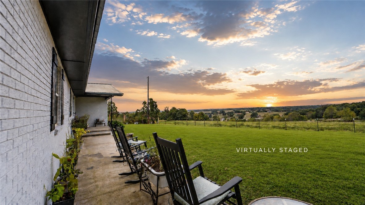 This house is made for slow days and front porch sittin'. Farm life + pool days + multi-family living = the perfect combination! With spring here and summer right around the corner, now is the perfect time to enjoy the gated in-ground pool. 

Set on over 21 acres, the home was designed for multi-family living with a duplex style setup. Outside, you’ll find barns, a shop, storm shelter, and plenty of room for livestock, hobbies, gardening, or simply enjoying the outdoors.

Also listed as MLS 1348920 with additional acreage available.