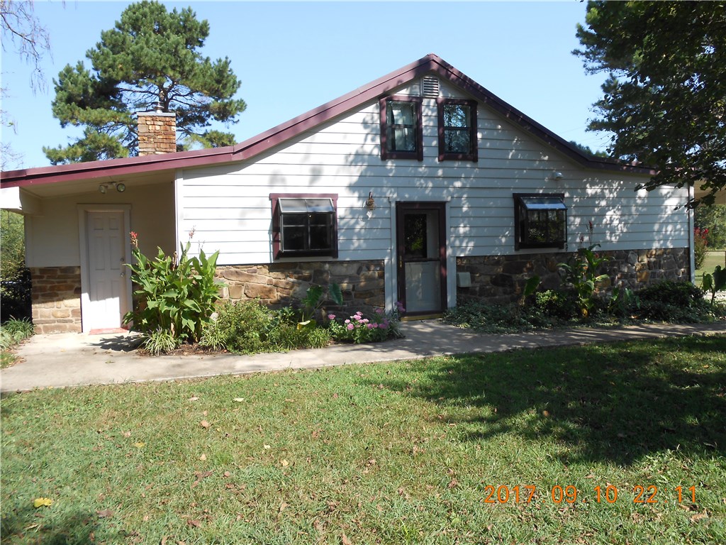 Open floor plan. Master bedroom and 1 bedroom on main room. Could be 2 bedroom on 2nd floor with 1/2 bath but low ceiling on 2nd floor. Original home built in 1969-completely removed and replaced with new home on old foundation in 2006 with all new material, wiring & plumbing. 4,800 sf 6 car garage/workshop with 7 overhead doors.