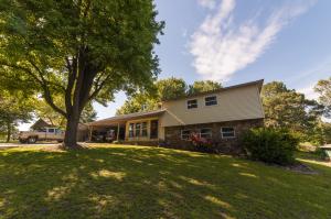 Many nice upgrades in this well kept 4 bedroom, 2.5 bath home on the south edge of town. Upgrades include floor coverings, roof, detached carport and pad for parking, windows, patio door, efficiency HVAC, and natural gas fireplace. Great location with a nice outdoor space. Quiet, cul-de-sac road.