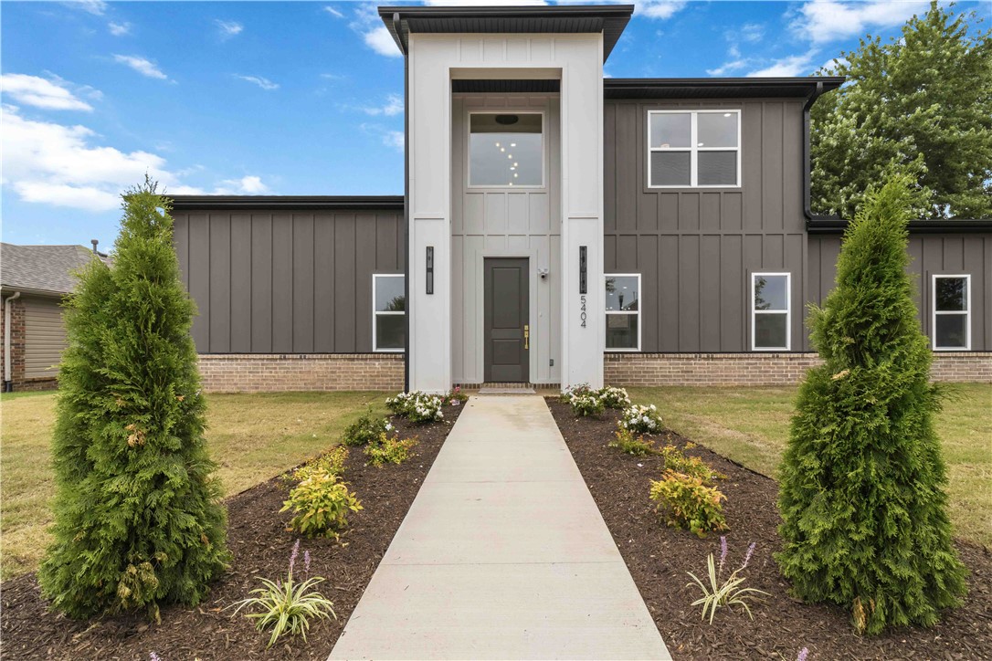Stunning new construction on a wide 0.20-acre EAST facing lot offering approx. 2,050 sqft with 3 beds and 2.5 baths. Rare side-entry 2-car insulated garage—the only one in the neighborhood. An 8-ft front door opens to a dramatic 20-ft entry and bright open-concept layout. Main level features 30 mil LVP flooring, electric fireplace, and a chef’s kitchen with ceiling-height custom cabinets, walk-in pantry, built-in oven/microwave, gas range with vent hood, and an 8-ft quartz island. Sliding doors lead to a covered patio with gas hookup plus side and backyard space. Primary suite on main level with high ceilings, walk-in shower with shower panel, and generous closets. Upstairs offers 2 bedrooms, full bath with double vanity and tiled surround, open flex space, built-in desk, attic access, and extra storage. Up to $7000 in buyer incentives available, including $3,500 seller concession & $3,500 preferred lender credit for qualified buyers.