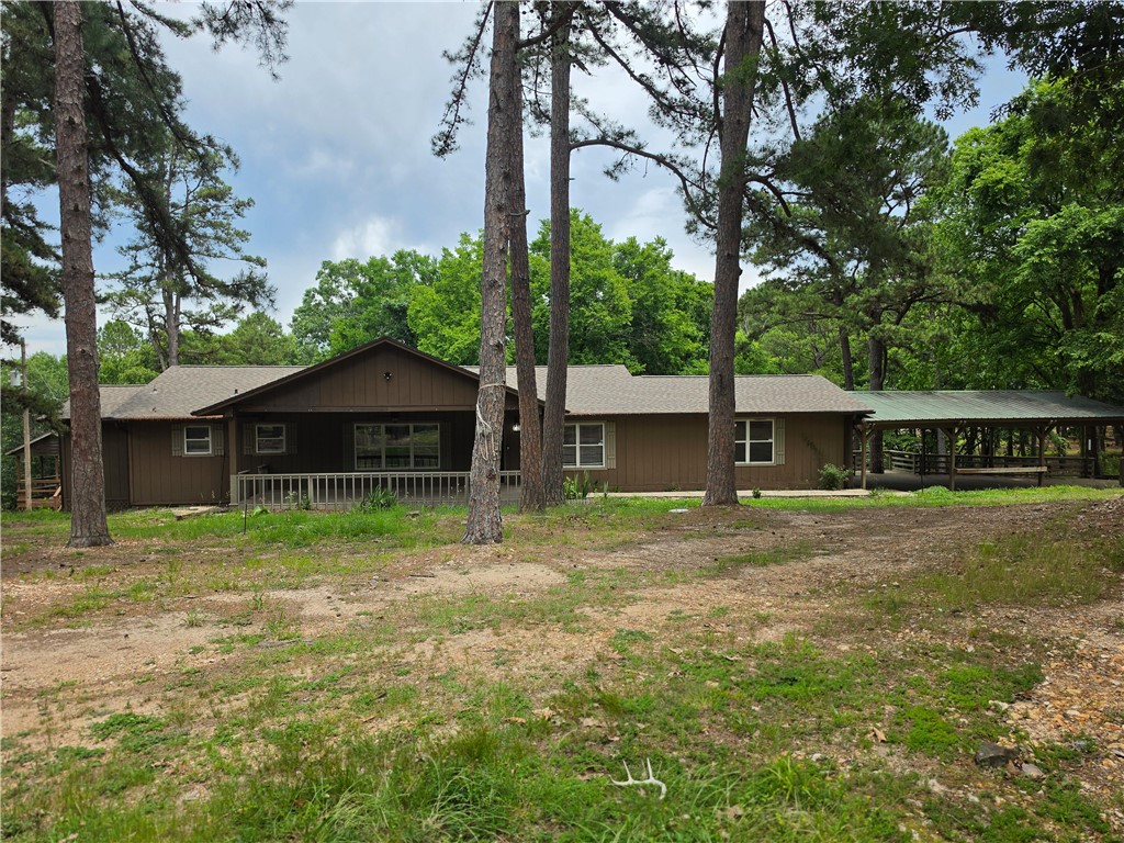 There aren't many properties left like this in Northwest Arkansas surrounded by State of Arkansas Park.
Tucked into the Beaver Shores neighborhood on nearly an acre of wooded hillside, this 3,096 sq ft log cabin home delivers the kind of privacy and natural beauty that's nearly impossible to find this close to town. Three bedrooms, three baths, multiple living areas, granite counters, walk-in closets, and built-in features throughout — all wrapped in the authentic charm of cabin construction.
You're five minutes from Beaver Lake access, fifteen minutes from Downtown Rogers, and a short drive to War Eagle Mill, Hobbs State Park, and the Karst trail system. The setting feels remote. The commute tells a different story.
Properties like this don't trade often. Don't  miss your opportunity. Motivated Seller