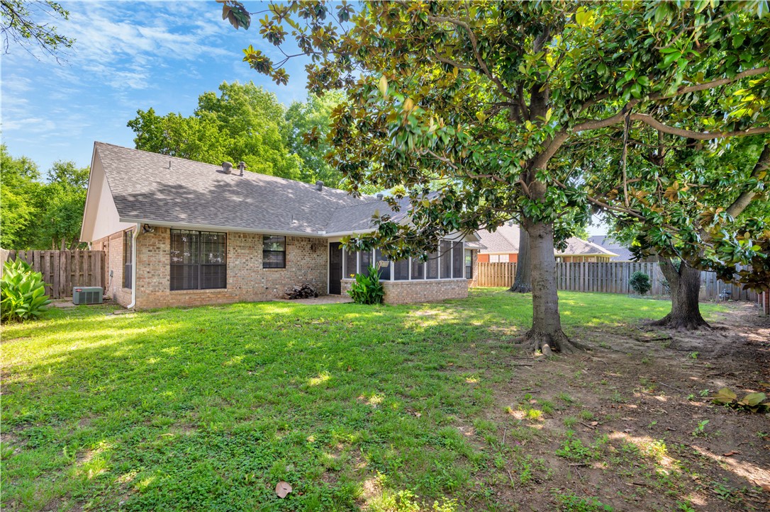 Nestled in an established neighborhood, this inviting 3-bedroom, 2-bath home offers the perfect blend of comfort and functionality. The level lot features landscaping, a welcoming partially covered front porch, and a fenced backyard designed for entertaining, gardening, or pets. A spacious screened-in porch extends the living space, providing a relaxing retreat to enjoy throughout the seasons. Inside you'll find a fireplace, built-in shelving, and a thoughtfully designed floor plan create an inviting atmosphere that's ideal for everyday living. Whether you're gathering with family or enjoying a quiet evening at home, this property offers comfort, character, and plenty of space to make it your own.