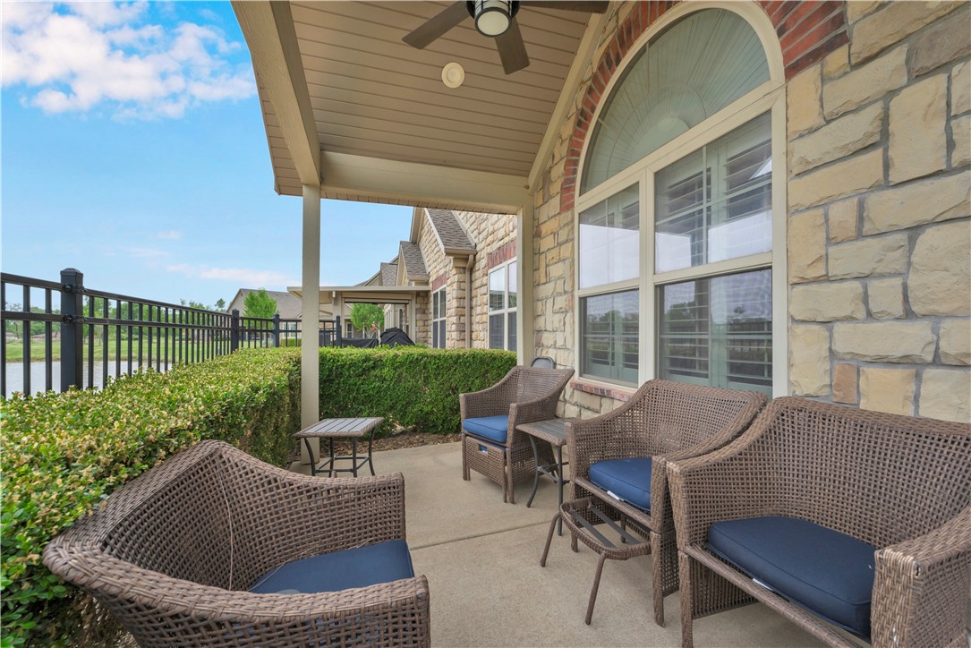 Stunning waterfront home in The Arbors, a sought-after 55+ Bentonville community offering maintenance-free luxury living. Enjoy peaceful water views from the cathedral ceiling covered patio, perfect for relaxing or entertaining. Plantation shutters add timeless charm throughout, while the rare 3-bedroom floor plan plus a dedicated office offers flexibility few homes in the community provide. The kitchen features a new backsplash (2025) and updated LED lighting (2022). The guest bath includes a brand-new shower (2025), and additional updates include comfort-height toilets (2020) and professional landscaping (2020) and new dishwasher (2026)!  A 2-car garage and 10x10 storage room provide added convenience. Preferred lender Angie Molina with Benchmark Mortgage is offering up to a 1% lender credit for qualified buyers.