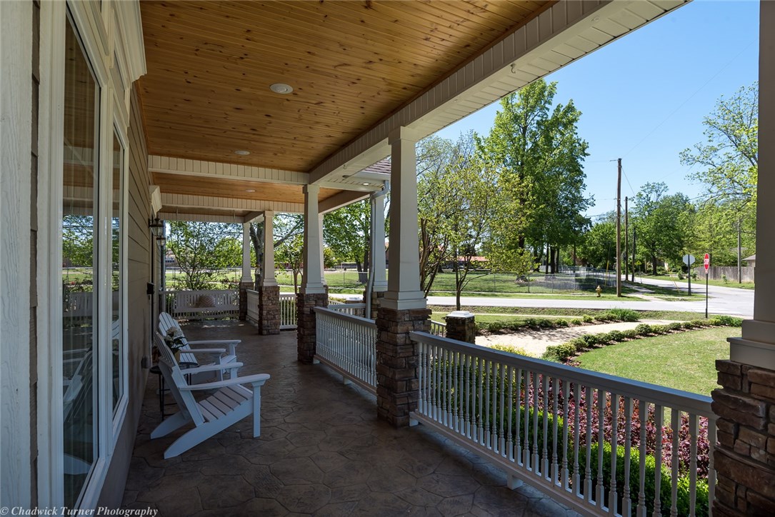 Downtown Bentonville, 3 car garage & Pool, what more could you want. This incredible home built in 2012 is filled with the charm of yesteryear. It features a beautiful stack stone fireplace, modern kitchen with Wolf range, vintage stained glass transoms, wine room and more. You will love the covered front porch and outdoor space including a covered TV porch, grassy side yard and outdoor bath. Two master suites plus all the other bedrooms have adjoining baths and walk-in closets. Great kids playroom!