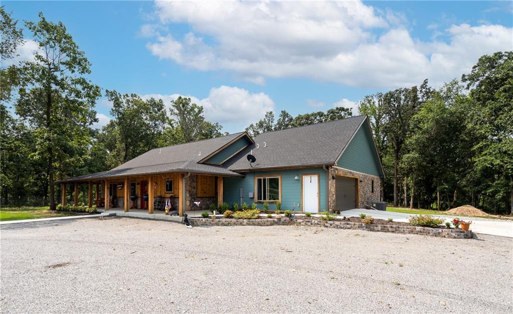 The home you always hope to find, custom build by the builder as his personal home. Great Location only begins to describe this custom country property. Easy drive to XNA, Bentonville, Lowell and all NWA. Amenities list in Documents will help. Keyless entry to gate and home. Primary Bedroom with his and her closets and storm shelter access. Screened in porch overlooking pool, great for morning coffee. Wraparound porch where there is always a breeze. Electric blind control in Kitchen, Quiet close cabin doors and pull outs. Full house generator. Custom 60 x 40 drive-thru Shop with full bath including shower, full shop generator, 50 amp RV service. Greenhouse and portable shed remain. Watch for more photos coming soon.