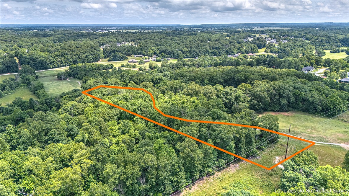 Nestled at the dead end of a quiet road in Pea Ridge, this beautiful golf course front lot offers the perfect blend of privacy, scenery, and opportunity. Overlooking the rolling greens of Big Sugar Golf Course, this is an ideal setting to build your dream home with peaceful views and room to spread out. This level 1.47 acre tract of land overlooks the golf course holes #4 & #5, located directly between two greens. Enjoy the feeling of seclusion while still being just minutes from conveniences in Pea Ridge and Rogers. Surrounded by impressive custom homes, this property offers a rare chance to create your own private retreat in one of the area’s most scenic settings. Big Sugar Golf Course is known for its dramatic elevation changes, challenging layout, and affordable public play, making it a favorite destination for golf enthusiasts across Northwest Arkansas.
