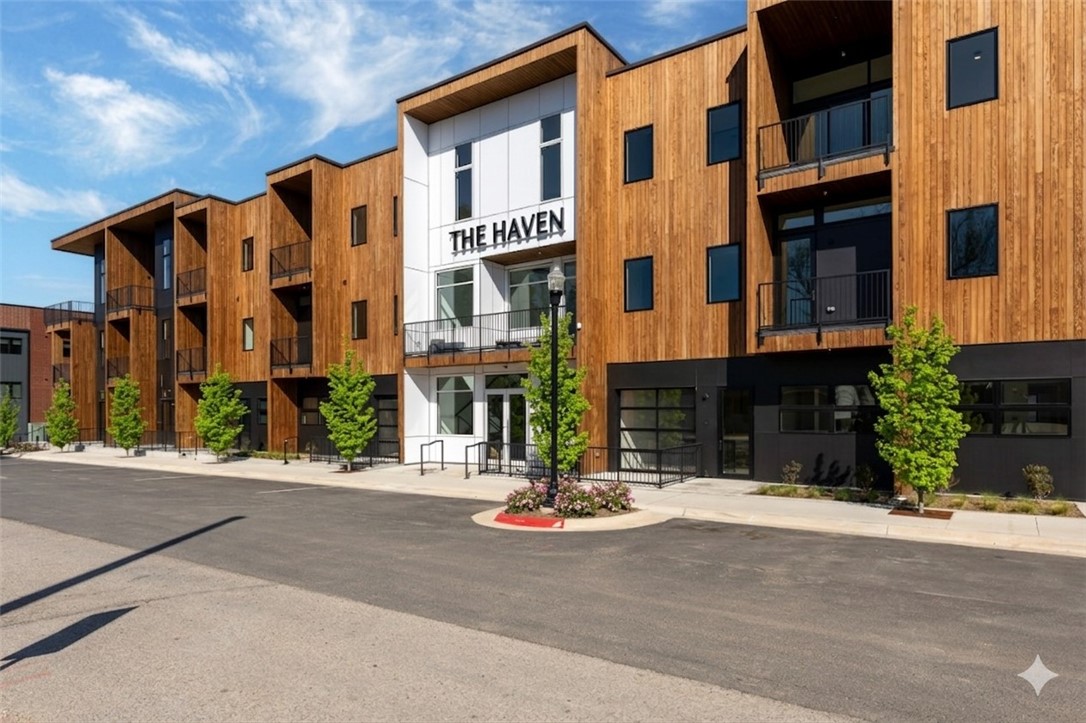Experience downtown Bentonville living at The Haven, a boutique 29-unit luxury condominium community ideally located near the Walmart Home Office, local dining, coffee shops, and the Razorback Greenway. Unit 203, known as the Rockwell, is a thoughtfully designed 1-bedroom, 1-bath residence offering comfort, style, and convenience. The open living space is complemented by a well-appointed kitchen featuring a full appliance package and generous workspace for everyday living and entertaining. A standout feature is the oversized laundry room, providing exceptional storage and functionality rarely found in condominium living. Step outside to your private balcony complete with an attached storage area, creating additional room for bikes, gear, or seasonal items. This residence also includes a private one-car garage. Enjoy secured entry, elevator access, and a location that places downtown Bentonville and the Square just minutes away.
