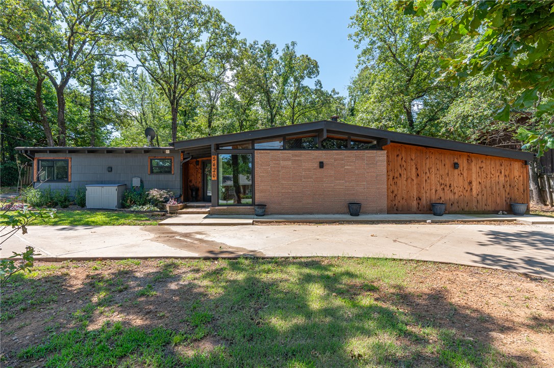 Midcentury Modern masterpiece on Country Club features 4 bedrooms and 2.5 baths. Completely rebuilt from the studs up within the last two years, designed to impress, with Forno commercial-grade appliances, to the striking live edge countertops, granite finishes, and the folding patio door that connects indoor and outdoor living with a Sonos surround sound brings the atmosphere to life.
Retreat to the primary bath, where you’ll find a luxurious walk-in shower, soaker tub, urinal, and heated floors for that extra touch of comfort. Entertain in style in the dedicated media room, complete with a wet bar, and professional lighting. Covered patio is ready for relaxation or celebrations, with hardscape tailored for a future hot tub , and prewiring for a whole-home generator. 
Located just around the corner from Hardscrabble Country Club, this home radiates confidence and character. Come see what all the excitement is about—this is where every moment is worth sharing. Schedule your showing today.