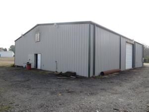 Are you looking for a location for your new commercial business? This property has lots of potential opportunities in a developing community.Large Shop portion of building with two bays for loading or unloading, Well Kept office space, and loft area with built in storage shelves and extra storage space. Available lease options for $1,000 a month.