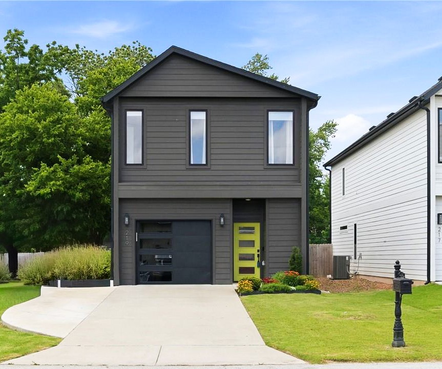 Experience the perfect blend of modern style, energy efficiency, and an unbeatable location just one block from the Razorback Greenway! This boutique-style row home offers it all. Open-concept main level features high ceilings and large windows that flood the main living area with natural light. The kitchen features granite countertops, Energy Star appliances, and an 8-foot walk-in pantry with unparalleled storage.
Upstairs, you will find a highly functional layout with all 3 bedrooms and the laundry room conveniently situated on the second floor. 
This home features an upgraded heat pump, smart thermostat, LED lighting, and a dedicated 240V EV charging outlet in the garage. The extra-deep 0.35-acre lot provides an expansive backyard, complete with a storage shed. 
Contemporary finishes, certified energy savings, zero HOA fees, and just a short walk to all the restaurants and entertainment downtown Rogers has to offer. This home checks every box. Act fast and lock in your slice of downtown Rogers living today!
