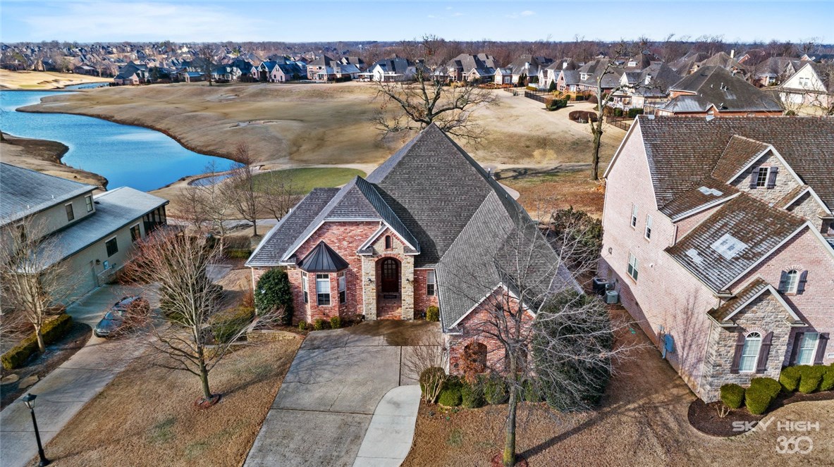 What a view! Sunsets over the 3rd green with view of Shadow Valley Lake. This home was made for entertaining! Golf front home includes golf membership. Open concept with over-sized kitchen that has NEW double ovens, gas range, pot filler wine cooler, and island with extra sink. Gorgeous bead board trey ceiling. Fresh paint! Hard wood floors throughout the main level with 2 bedrooms and 2 bathrooms. Executive office with custom built-ins. HUGE master closet with built-in dresser. Walk-in shower and jacuzzi tub in master bathroom. Finished walk-out basement has second living area with fireplace. Golf cart garage at basement level. TWO laundry rooms - one upstairs and one downstairs. This home truly has it all.