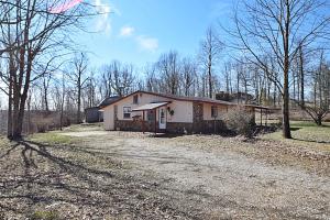 Nestled in the Ozark Mountains between Harrison and Russellville...This two bedroom two bath home sits on approx. 3.25 acres that joins the National Forest.  The kitchen features lots of storage with custom cabinets.  The outbuildings allow for garage parking, storage, or additional living space could be created above the garage.  Seller is motivated, so don't miss out on this property!