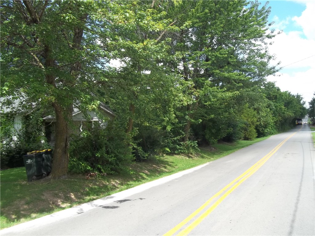 3702 Oak St. Springdale. 20 Acres plus or minus Development potential. Bethel Heights step system sewer. Water, gas & electric available. some floodplain, excellent for Planned Unit Development (P.U.D.) with green space. MAI (Rife)  appraisal in listing office. Dwelling is of no value